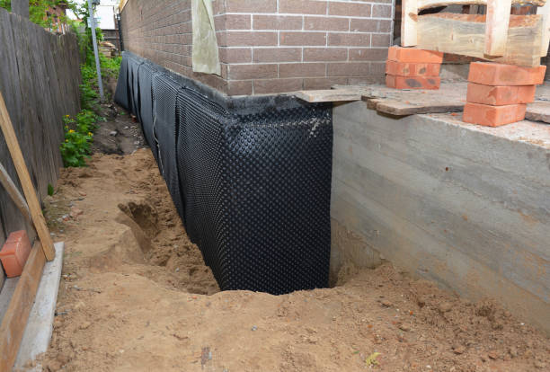 SJ Waterproofing Pros technician performing targeted Basement Waterproofing assessment in Andale, KS